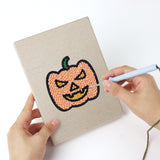 Punching a Robot and Lollipop mini canvas with the punch needle