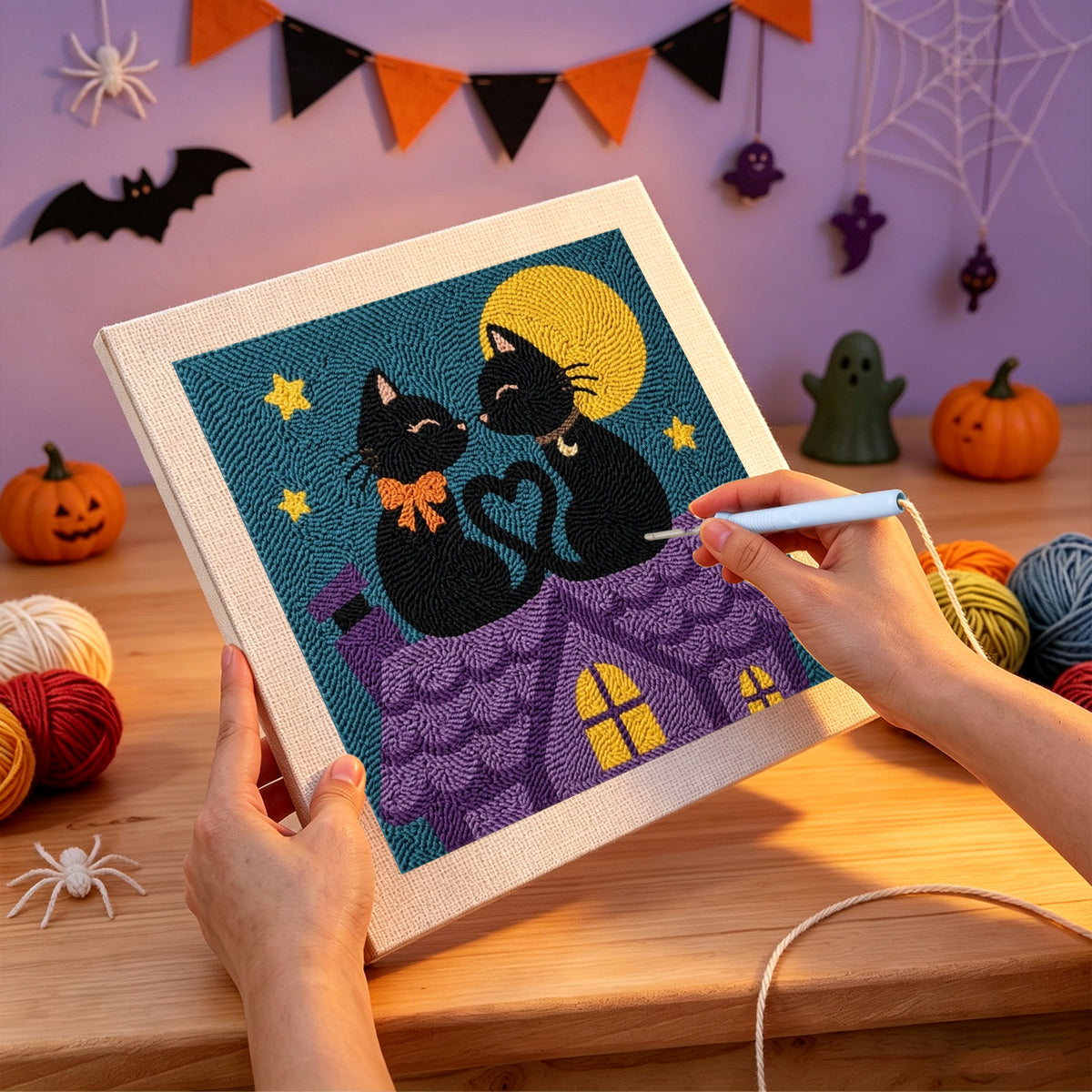 Punching the Rooftop Cats in Love design with the punch needle
