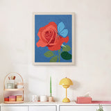 Finished Rose and Butterfly punch needle canvas on a wall