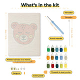 What is in the Rosy Cheek Bear kit: printed canvas, punch needle, threader, threads, color guide and hangers