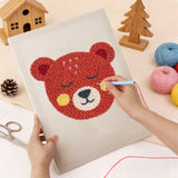 Punching the Rosy Cheek Bear design with the punch needle