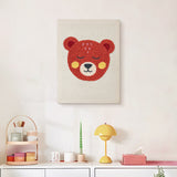 Finished Rosy Cheek Bear punch needle canvas on a wall