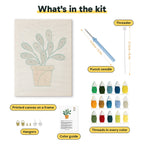 What is in the Round Leaf Plant kit: printed canvas, punch needle, threader, threads, color guide and hangers