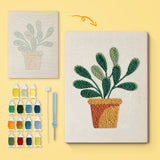Round Leaf Plant canvas before and after punching, with the threads and tools