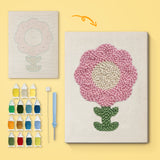 Round Pink Bloom canvas before and after punching, with the threads and tools