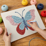 Punching the Ruby Wing Butterfly design with the punch needle