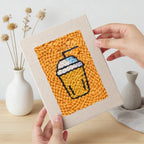 Hand holding a finished Salmon Sushi Lunch mini canvas
