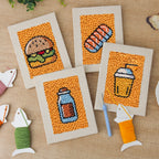 The four finished Salmon Sushi Lunch mini canvases laid out on a table