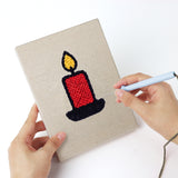 Punching a Santa and Candle mini canvas with the punch needle