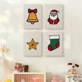 The four Santa and Stocking mini canvases on a wall above a shelf
