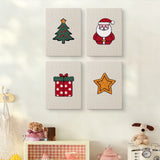 The four Santa and Tree mini canvases on a wall above a shelf