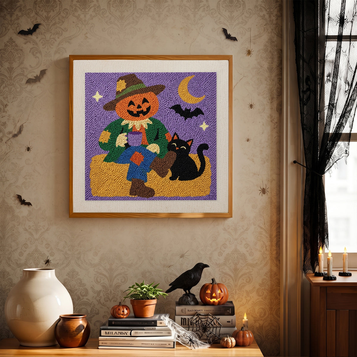 Finished Scarecrow and Cat punch needle canvas on a wall