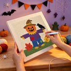 Punching the Scarecrow on the Hill design with the punch needle