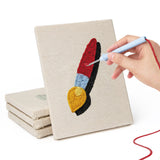 Hand punching one of the Science Class Flask mini canvases