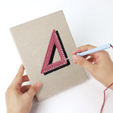 Punching a Science Class Flask mini canvas with the punch needle