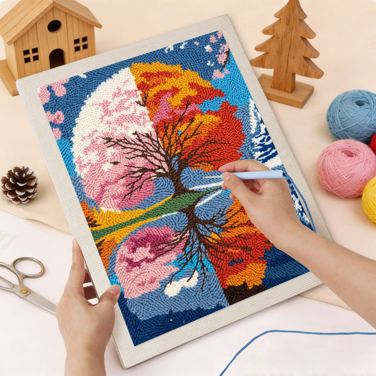 Punching the Seasons Tree Mirror design with the punch needle