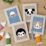 The four finished Sheep and Panda mini canvases laid out on a table