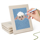 Hand punching one of the Sheep and Panda mini canvases