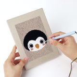 Punching a Sheep and Panda mini canvas with the punch needle