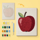 Shiny Red Apple canvas before and after punching, with the threads and tools