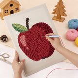 Punching the Shiny Red Apple design with the punch needle