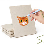Hand punching one of the Siamese and Tuxedo mini canvases