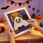 Punching the Siamese Cat Ghost design with the punch needle