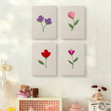 The four Single Stem Flowers mini canvases on a wall above a shelf