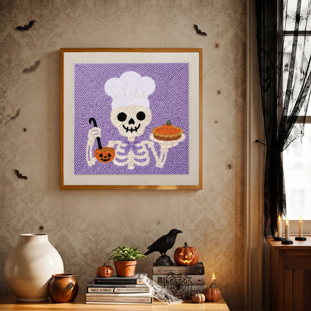 Finished Skeleton Chef punch needle canvas on a wall
