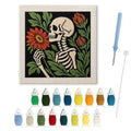 Skeleton Smelling a Flower punch needle kit: finished canvas with threads, punch needle and threader
