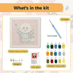 What is in the Skeleton Suit Ghost kit: printed canvas, punch needle, threader, threads, color guide and hangers