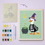 Skeleton Suit Goose canvas before and after punching, with the threads and tools