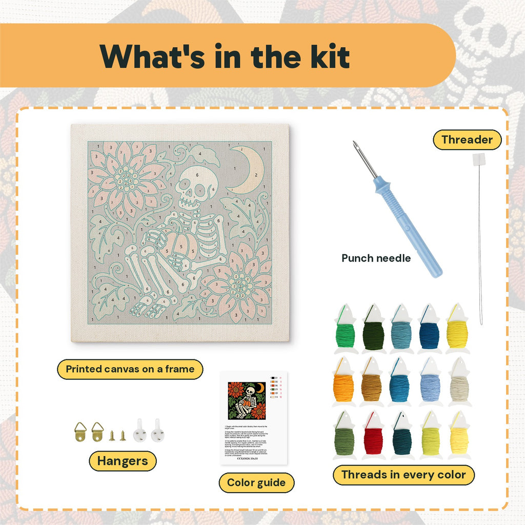 What is in the Skeleton with Pumpkin kit: printed canvas, punch needle, threader, threads, color guide and hangers