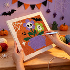 Punching the Skull Flower Cauldron design with the punch needle
