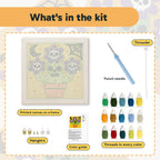 What is in the Skull Flower Pot kit: printed canvas, punch needle, threader, threads, color guide and hangers