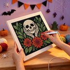 Punching the Skull in Hands design with the punch needle
