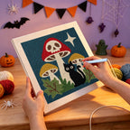 Punching the Skull Mushroom Cat design with the punch needle