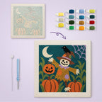 Skull Scarecrow Patch canvas before and after punching, with the threads and tools