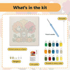 What is in the Skull Tree and Ghost kit: printed canvas, punch needle, threader, threads, color guide and hangers