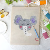 Sleepy Elephant canvas before and after punching, with the threads and tools