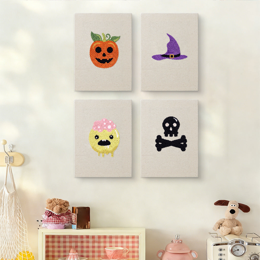 The four Slime and Crossbones mini canvases on a wall above a shelf
