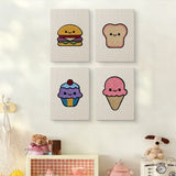 The four Smiley Snacks mini canvases on a wall above a shelf