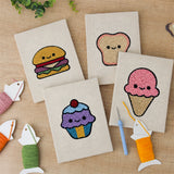 The four finished Smiley Snacks mini canvases laid out on a table