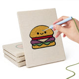 Hand punching one of the Smiley Snacks mini canvases