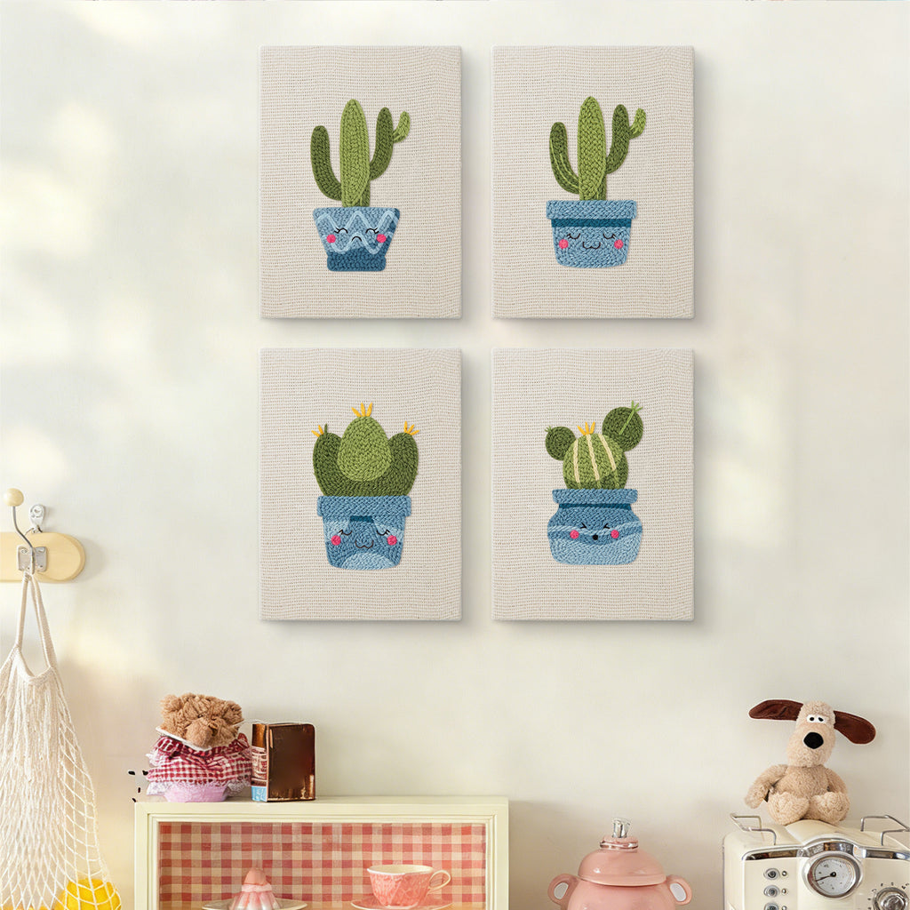 The four Smiling Blue Pots mini canvases on a wall above a shelf