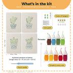 What is in the Smiling Blue Pots set: 4 printed canvases, punch needle, threader, threads, color guide and 4 sets of hangers (6 × 8 in (15 × 20 cm) each)