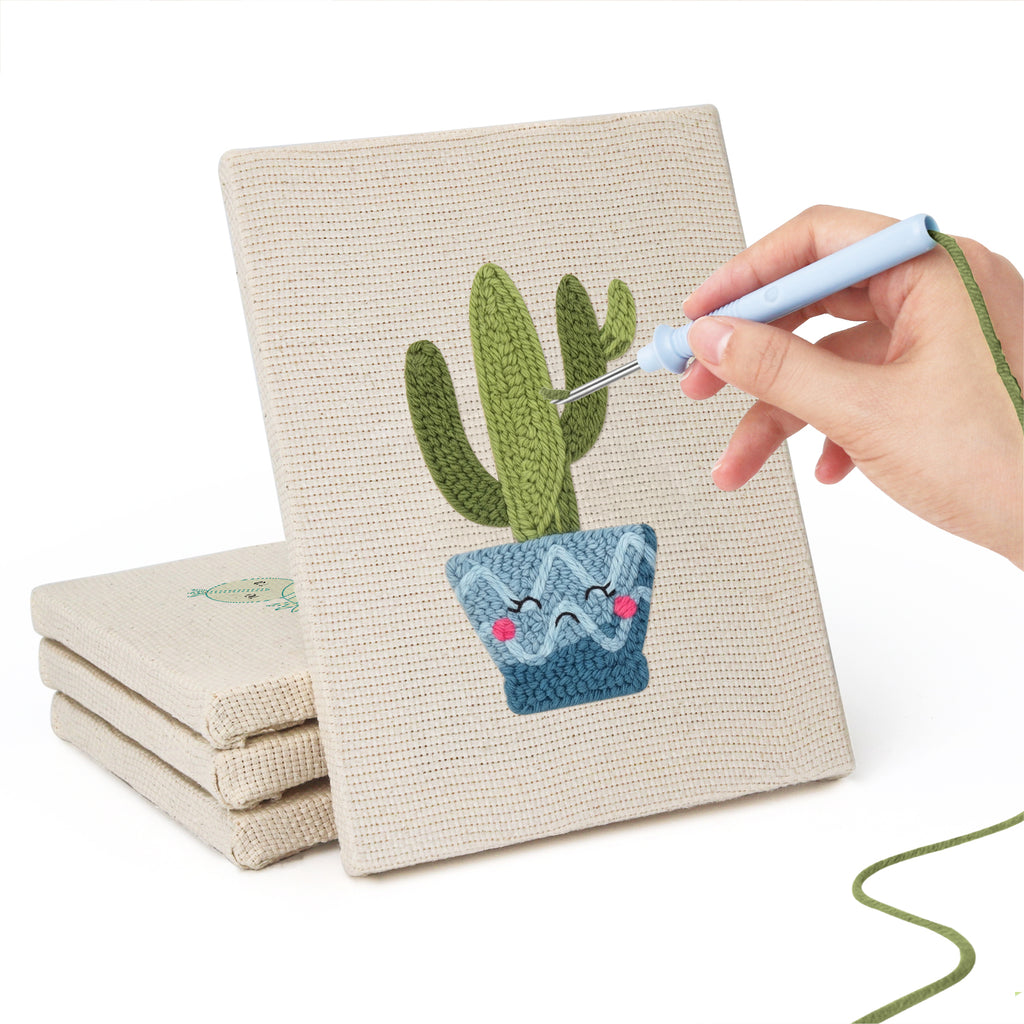 Hand punching one of the Smiling Blue Pots mini canvases