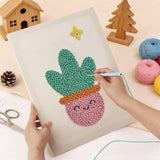 Punching the Smiling Pink Pot design with the punch needle