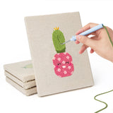 Hand punching one of the Smiling Pink Pots mini canvases