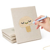 Hand punching one of the Smiling Veggies mini canvases